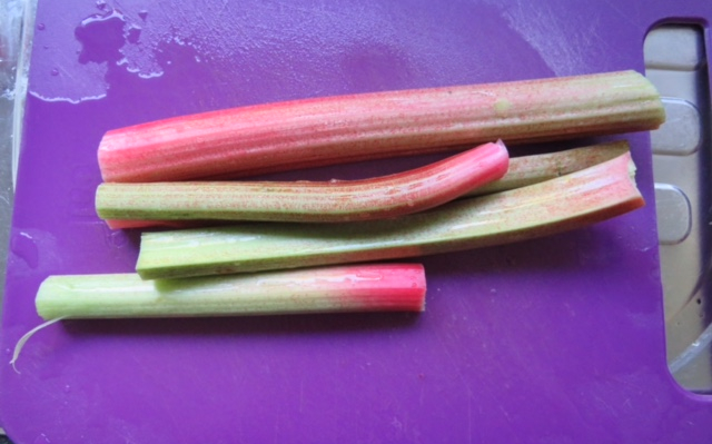 Trimmed rhubarb sticks on a chopping board